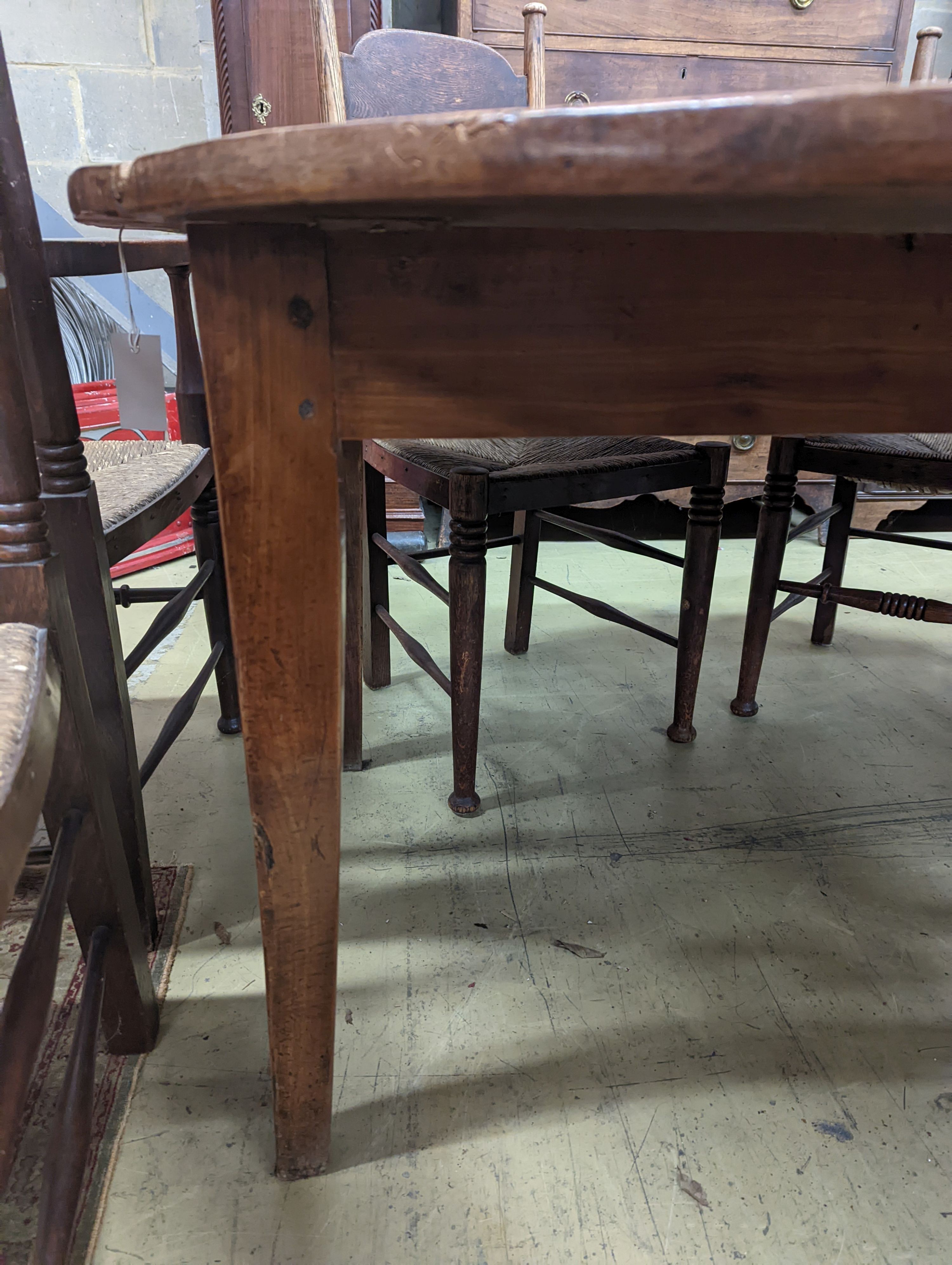 A 19th century French fruitwood circular dropleaf dining table, length 145cm extended, width 144cm, height 73cm